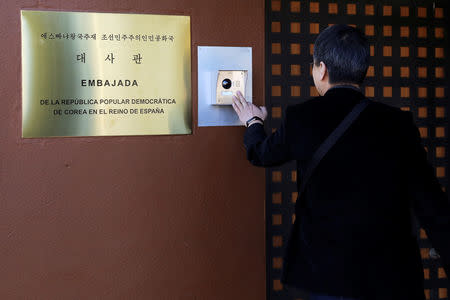 A journalist from South Korea rings an intercom of North Korea's embassy in Madrid, Spain February 28, 2019. REUTERS/Sergio Perez