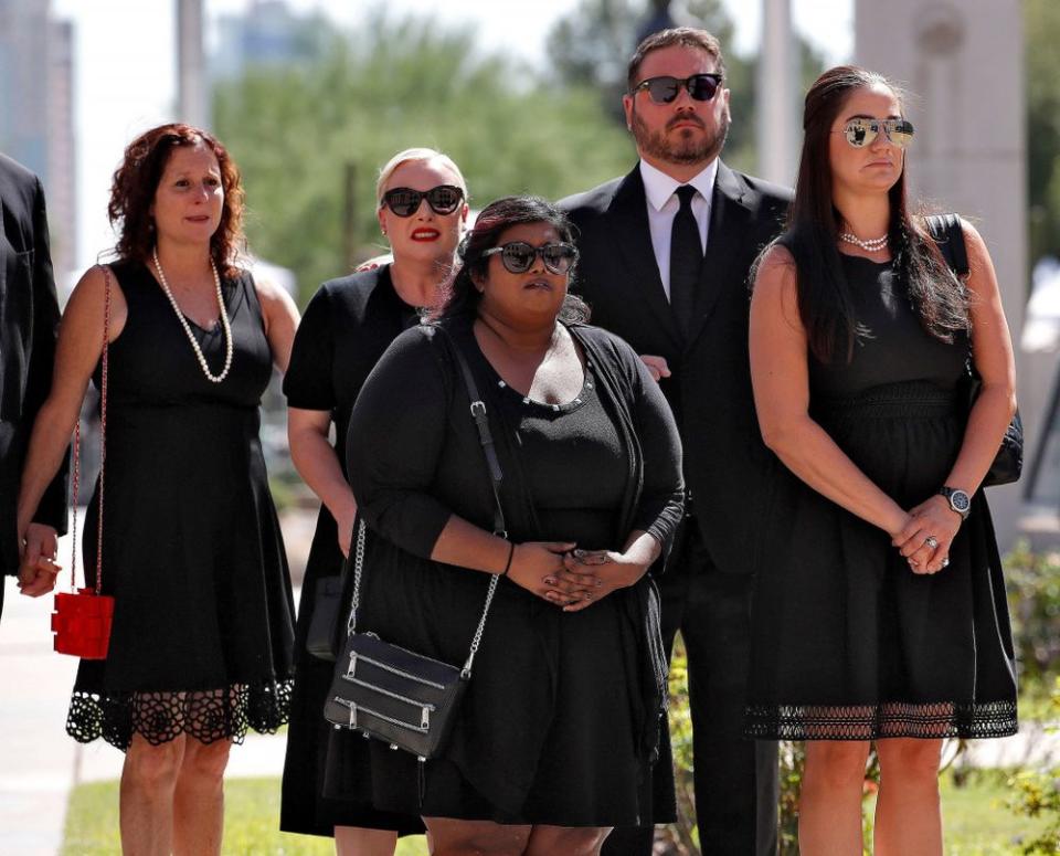 The children of Sen. John McCain, from back left: Sidney McCain, Meghan McCain and husband Ben Domenech, Bridgett McCain, front center daughter-in-law Holly McCain, follow behind the casket into the Capitol rotunda for a memorial service