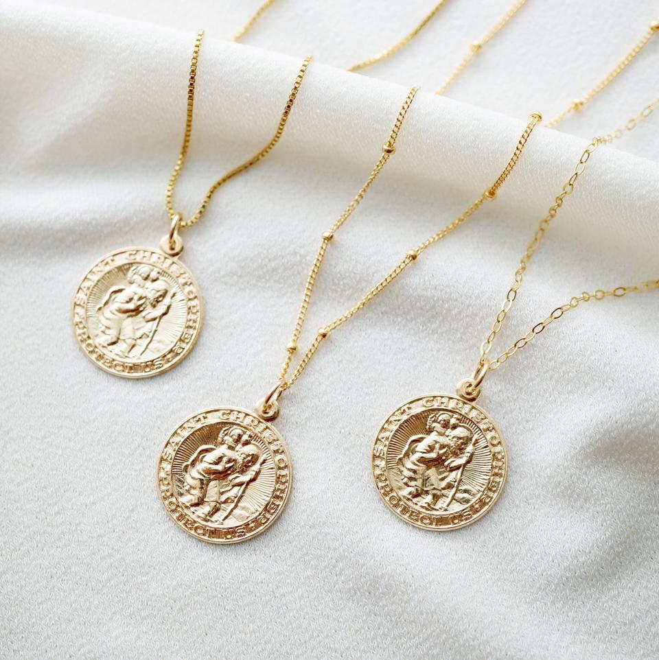 Traveler's Protection Gold Coin Medallion Necklace with 14K gold fill by Hunter and Trove, from $52. 