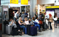 People wait with their luggage at Heathrow Terminal 5 in London, Britain May 27, 2017. REUTERS/Neil Hall