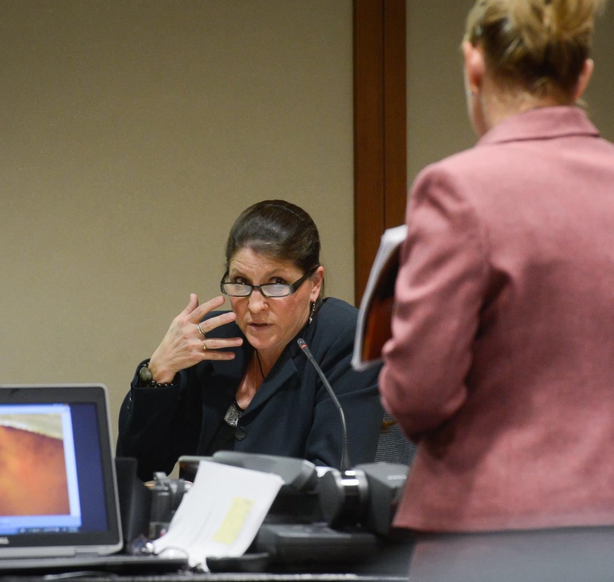 Dr. Sally Smith, seen here testifying in a June 2014 murder trial in Sarasota, testified before a jury through video depositions on Thursday, Oct. 12, 2023, in the civil trial of a Venice family suing Johns Hopkins All Children's Hospital for false imprisonment, negligent infliction of emotional distress, medical negligence, battery, and other claims. Maya Kowalski was a patient at All Children’s when Smith’s accusations led to a court order that prevented her parents from seeing her.