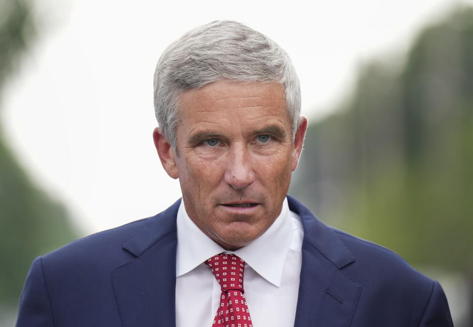 PGA Tour Commissioner Jay Monahan leaves after speaking with sports commentator Jim Nantz regarding the LIV Golf tour during fourth round of the Canadian Open at St. George's Golf and Country Club in Toronto, Sunday, June 12, 2022. (Nathan Denette/The Canadian Press via AP)