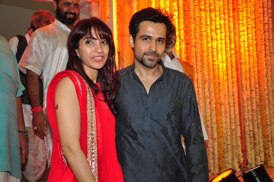 MUMBAI, INDIA - JANUARY 29: Indian actor Emraan Hashmi with wife Parveen Shahani during Mohit Suri and Udita Goswami's wedding ceremony at Iscon Temple, Juhu on January 29, 2013 in Mumbai, India. (Photo by Amlan Dutta/Hindustan Times via Getty Images)