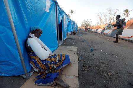 Madelana Jose, 71, rests beside her tent at a camp for people displaced in the aftermath of Cyclone Idai in Beira, Mozambique March 30, 2019. REUTERS/Zohra Bensemra