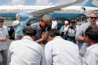 <p>U.S. President Barack Obama greets workers after landing aboard Air Force One at Henderson Field to visit the Papahanaumokuakea Marine National Monument, Midway Atoll, Sept. 1, 2016. (Photo: Jonathan Ernst/Reuters) </p>
