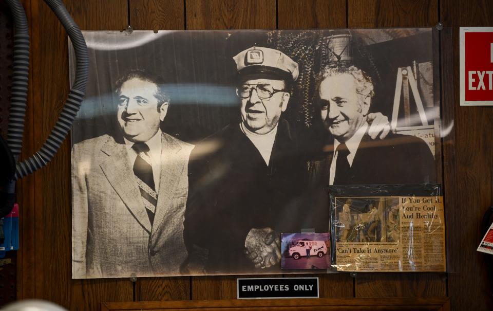 An old photo of owner Raymond Grimaldo, Jr.'s father, Raymond Sr., right, and uncle Bill Grimaldo, left, with actor Jesse White, center, who played the Maytag repairman in TV commercials.