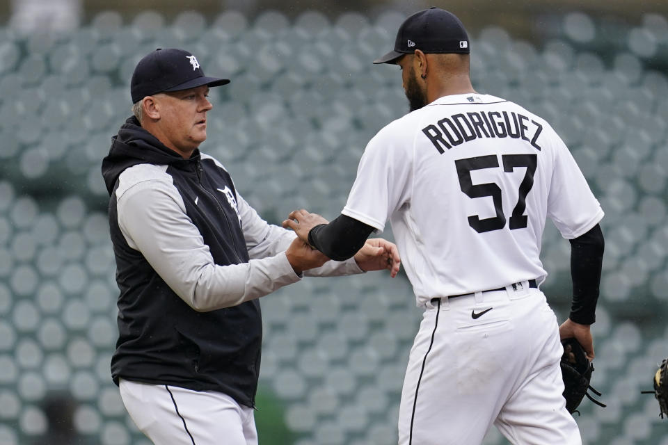 Detroit Tigers manager AJ Hinch takes the ball from pitcher Eduardo Rodriguez (57) in the fourth inning of a baseball game against the Boston Red Sox in Detroit, Wednesday, April 13, 2022. (AP Photo/Paul Sancya)