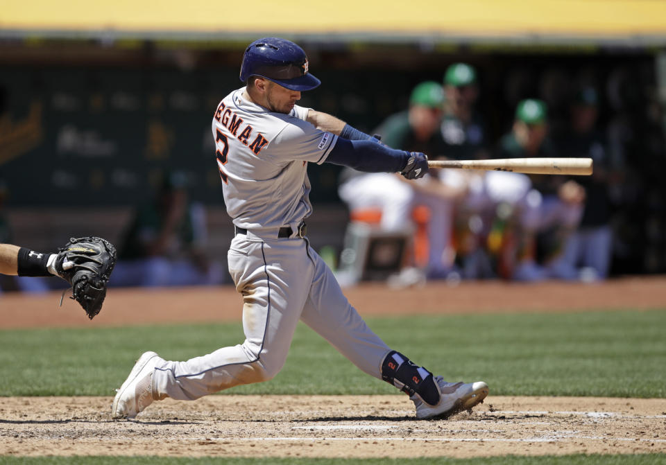 Houston Astros' Alex Bregman swings for a three-run home run off Oakland Athletics' Brett Anderson in the fifth inning of a baseball game Sunday, Aug. 18, 2019, in Oakland, Calif. (AP Photo/Ben Margot)