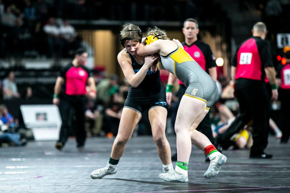 Lewis Central's Mahri Manz, left, wrestles Southeast Polk's Mya Holdaway at 140 pounds during the IGHSAU state girls wrestling tournament, Thursday, Feb. 2, 2023, at the Xtream Arena in Coralville, Iowa.
