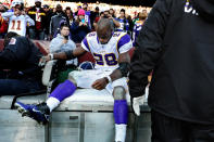 LANDOVER, MD - DECEMBER 24: Running back Adrian Peterson #28 of the Minnesota Vikings is helped off the field after being injured in the third quarter against the Washington Redskins at FedEx Field on December 24, 2011 in Landover, Maryland. (Photo by Patrick Smith/Getty Images)