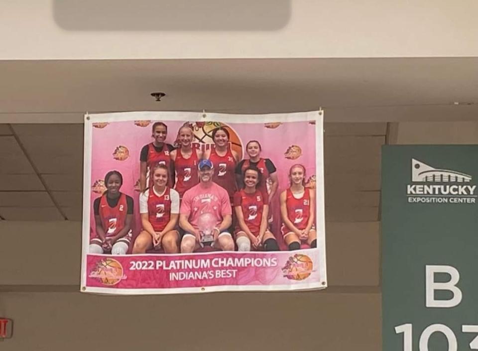 Indiana's Best Basketball Club founder Travis Best shares off the banner his team earned led by current McCutcheon freshman Lillie Graves in Louisville, Kentucky in July 2022.