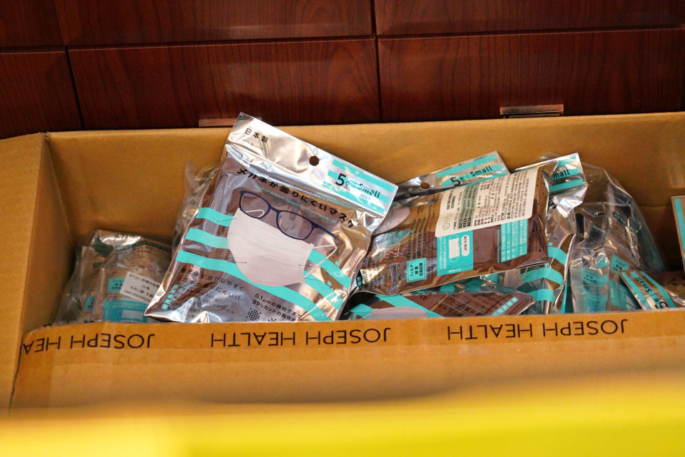 A box of masks imported from Japan sits inside a Yifeng Pharmacy in Wuhan, China, Wednesday, Jan. 22, 2020. Pharmacies in Wuhan are restricting customers to buying one mask at a time amid high demand and worries over an outbreak of a new coronavirus. The number of cases of the new virus has risen to over 400 in China and the death toll to 9, Chinese health authorities said Wednesday. (AP Photo/Dake Kang)