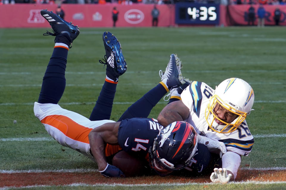 Denver Broncos wide receiver Courtland Sutton scores past Los Angeles Chargers cornerback Casey Hayward during the first half of an NFL football game Sunday, Dec. 1, 2019, in Denver. This was Denver Broncos quarterback Drew Lock's first touchdown pass. (AP Photo/Jack Dempsey)