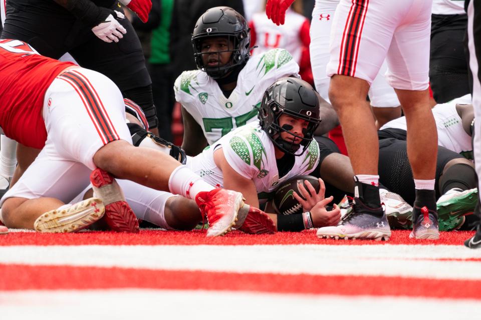 Oregon Ducks quarterback Bo Nix (10) scores a touchdown against the Utah Utes in the first quarter at Rice-Eccles Stadium Oct. 28, 2023, in Salt Lake City.