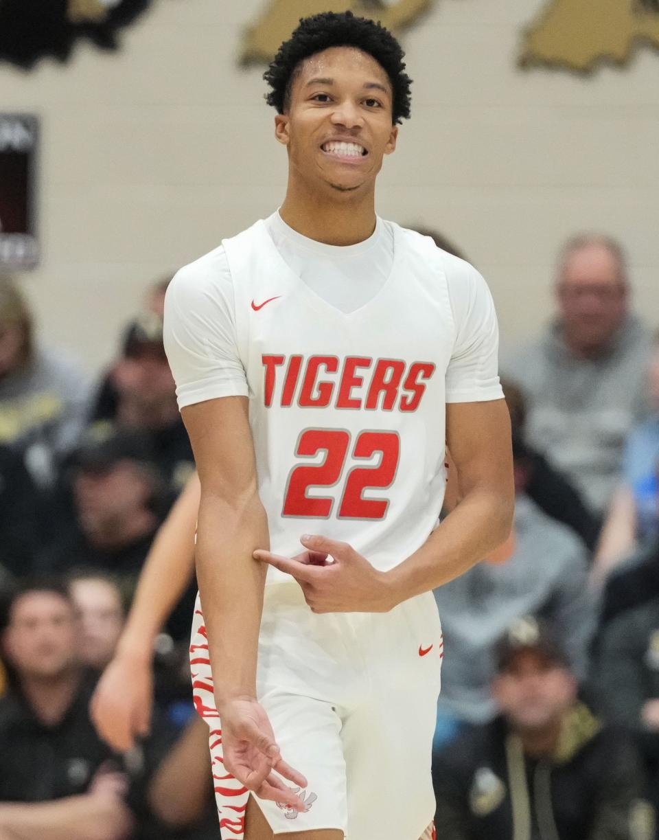 Fishers Tigers guard JonAnthony Hall (22) walks off the court after shooting a three-point basket Saturday, March 2, 2024, during the Class 4A sectional final at Noblesville High School in Noblesville. The Fishers Tigers defeated the Noblesville Millers, 49-47.