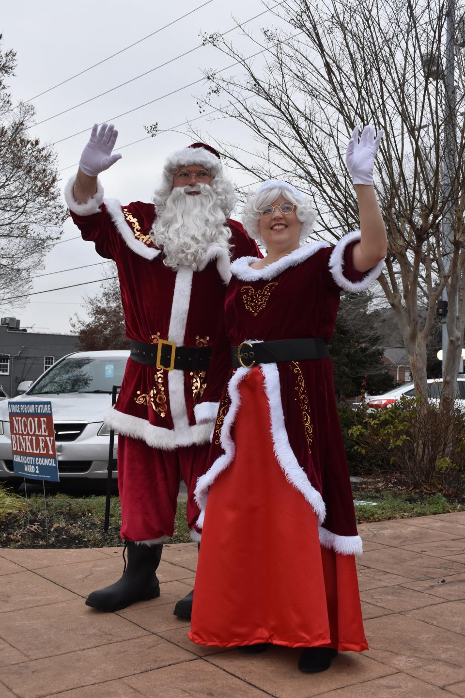 Santa and Mrs. Claus waved to passersby.