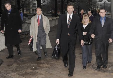 Blackwater Worldwide security guards Evan Liberty (L) and Dustin Heard (R) leave the federal courthouse with their legal team and supporters after being arraigned with 3 fellow Blackwater guards on manslaughter charges for allegedly killing 14 unarmed civilians and wounding 20 others in a 2007 shooting in Baghdad, in Washington, January 6, 2009. REUTERS/Jonathan Ernst