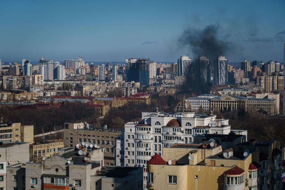 A smoke column rises after an attack in Kyiv on Saturday.