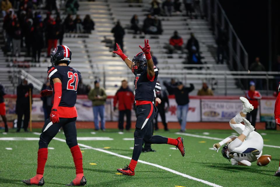 Aliquippa's Nate Lindsey-Gill celebrates a pass breakup against Bishop McDevitt Thursday in the PIAA Class 4A championship game in Mechanicsburg.