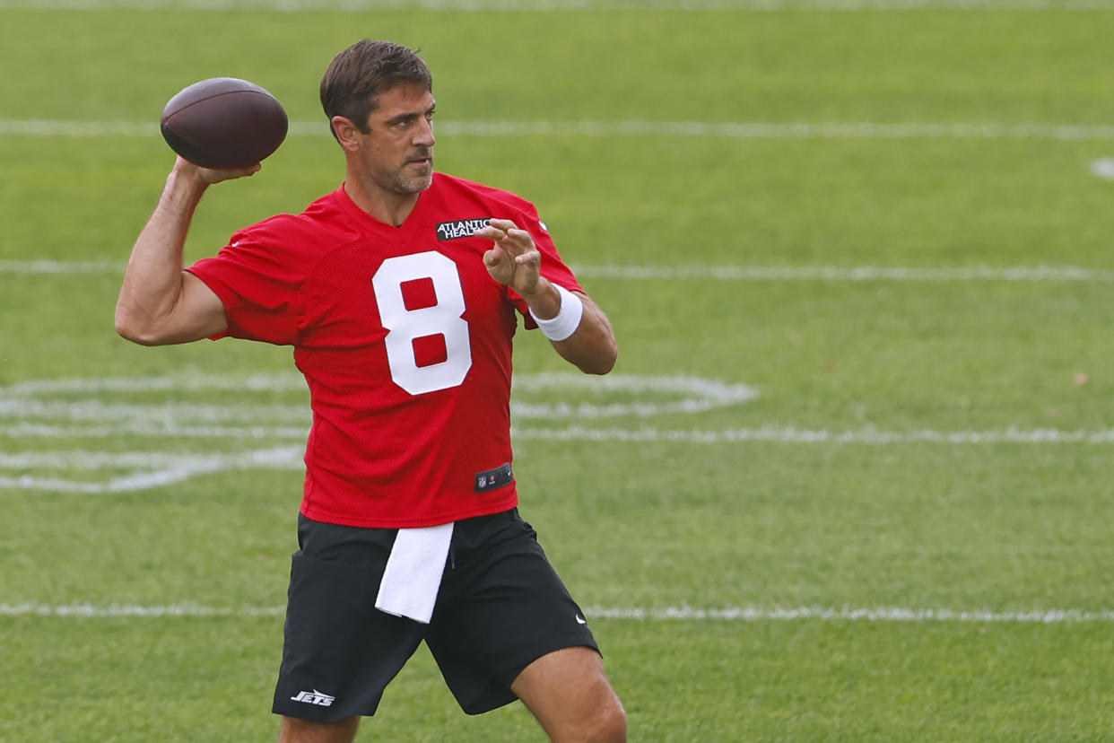 Aaron Rodgers runs a drill at Jets training camp on Wednesday. (AP Photo/Rich Schultz)