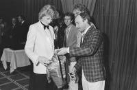 <p>The Genesis singer met Princess Diana in 1984 at a royal charity concert and wore a checkered sport coat with khaki pants. He also brought a miniature satin bomber jacket for the expectant mother.</p>