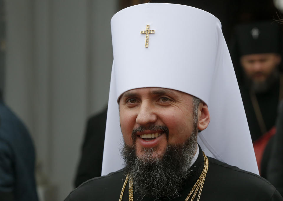 Metropolitan Epiphanius, newly elected head of the Orthodox Church of Ukraine, Metropolitan of Kyiv and All Ukraine, smiles after his enthronement as he leaves the St. Sophia Cathedral in Kiev, Ukraine, Sunday, Feb. 3, 2019. Epiphanius has been elected to head the new Ukrainian church independent from the Russian Orthodox Church. (AP Photo/Efrem Lukatsky)