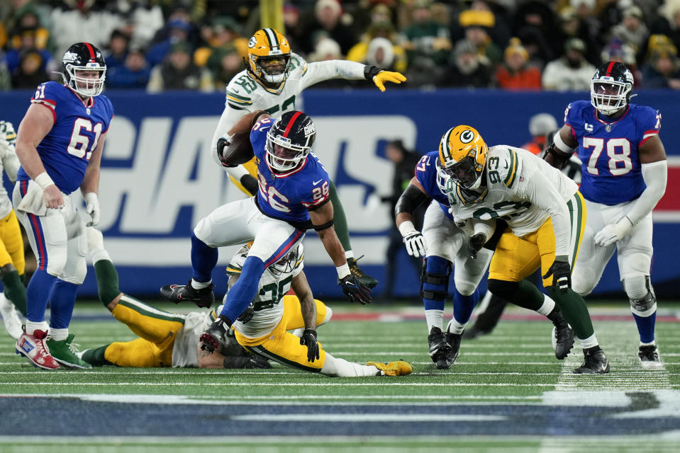 New York Giants running back Saquon Barkley (26) carries the ball against the Green Bay Packers during the fourth quarter of an NFL football game, Monday, Dec. 11, 2023, in East Rutherford, N.J. (AP Photo/Seth Wenig)