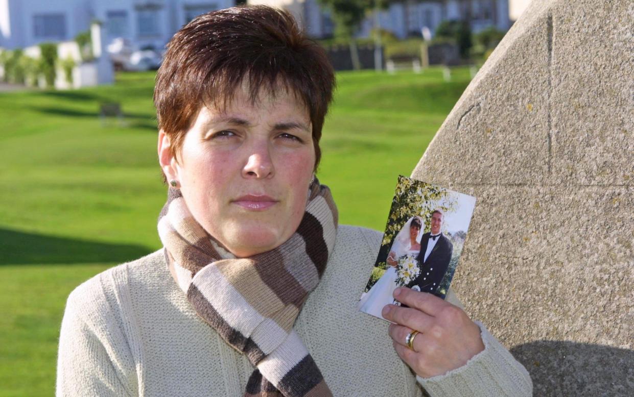 Veronica Wilson with a photograph taken of her and Alistair on their wedding day