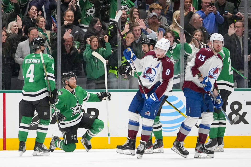 Dallas Stars center Joe Pavelski, kneeling, reacts after scoring a goal on the Colorado Avalanche during the second period of an NHL hockey game, Thursday, Jan. 4, 2024 in Dallas. (AP Photo/Julio Cortez)