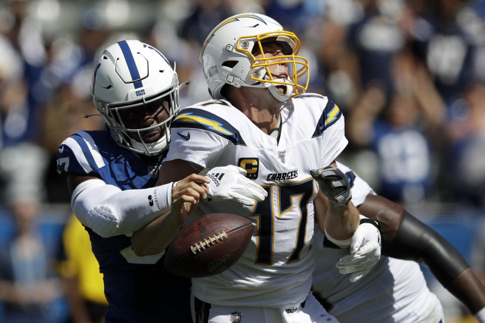 Los Angeles Chargers quarterback Philip Rivers, right, is sacked by Indianapolis Colts defensive end Kemoko Turay during the second half in an NFL football game Sunday, Sept. 8, 2019, in Carson, Calif. (AP Photo/Marcio Jose Sanchez)