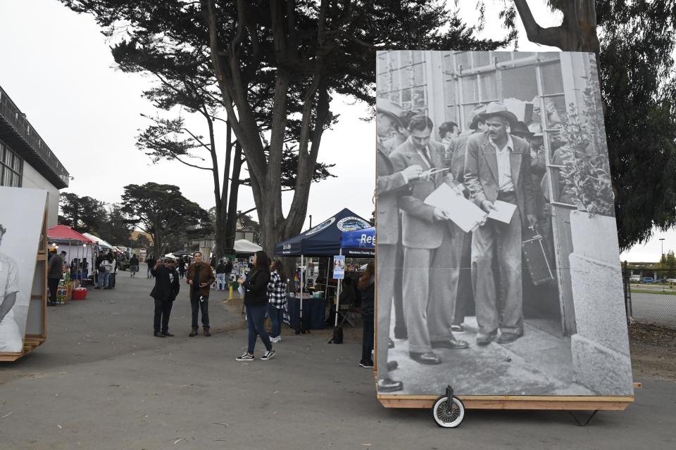 A Braceros photo from the Ernesto Galarza collection is displayed at the Salinas Sports Complex in Salinas.