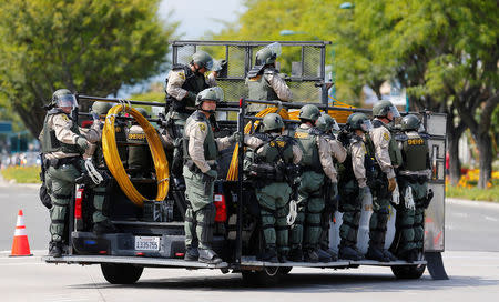 Los Angeles Sheriff Department deputies ride a vehicle during demonstrations against Republican U.S. Presidential candidate Donald Trump, who spoke at a campaign event in Anaheim, California, U.S., May 25, 2016. REUTERS/Mike Blake