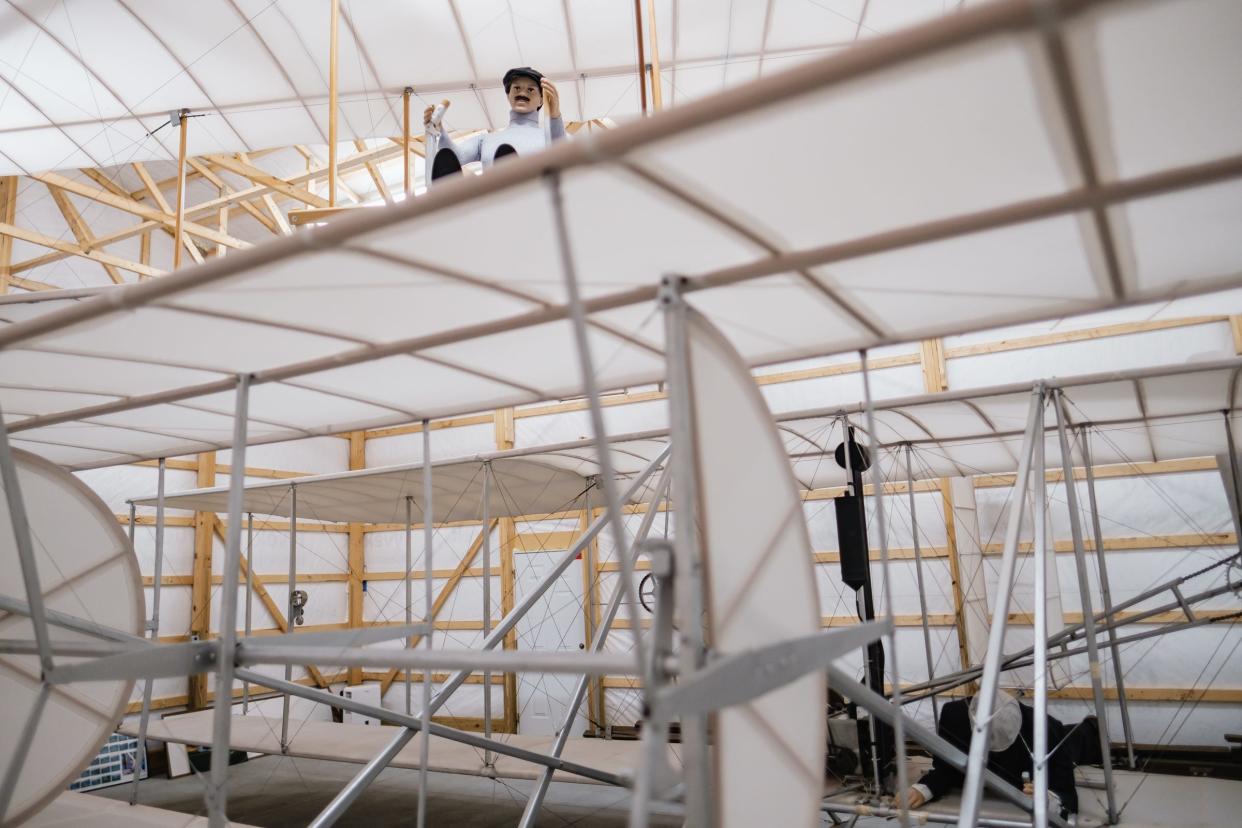 The 1905 Wright Flyer III, on the floor, and the 1911 Wright glider, suspended from the ceiling, are two of four Wright brothers' replica aircraft created and maintained by New Philadelphia resident Mark Dusenberry.