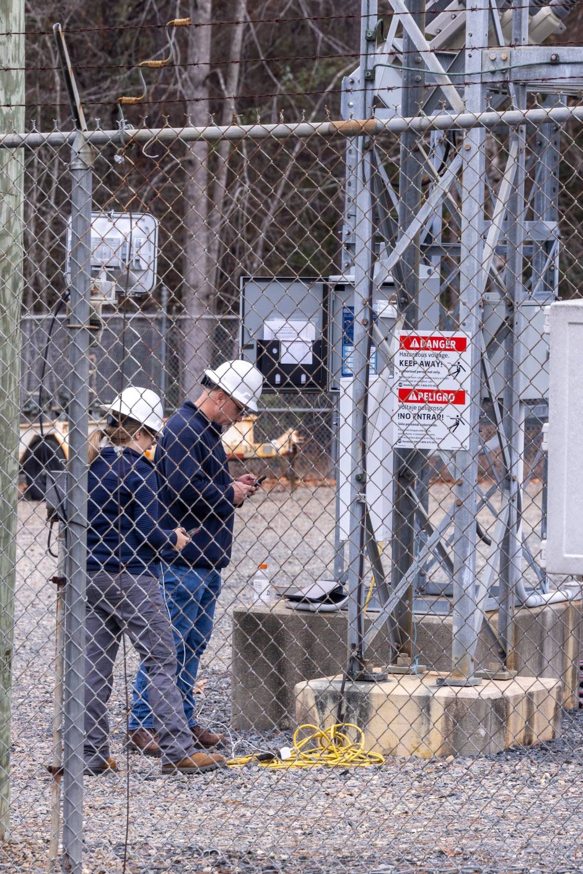 Workers with Randolph Electric Membership Corporation work to repair the Eastwood Substation in West End on Dec. 6, 2022. Two deliberate attacks on electrical substations in Moore County Saturday evening caused days-long power outages for tens of thousands of customers.