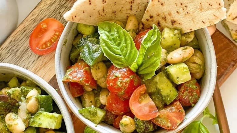 White bean pesto salad in bowls with pita