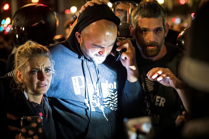 FILE PHOTO: Joey Gibson, leader of the right wing Patriot Prayer group, arrives at the scene of a shooting in Portland