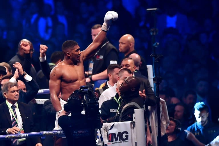 Britain's Anthony Joshua celebrates in the ring after his victory over Ukraine's Wladimir Klitschko in the eleventh round of their IBF, IBO and WBA, world Heavyweight title fight at Wembley Stadium in north west London on April 29, 2017