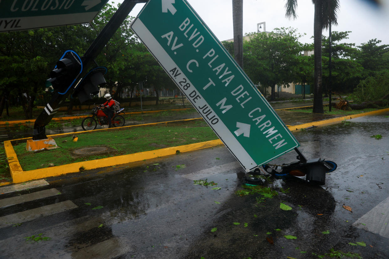 A traffic sign toppled by heavy winds and rain in Playa del Carmen, Mexico.