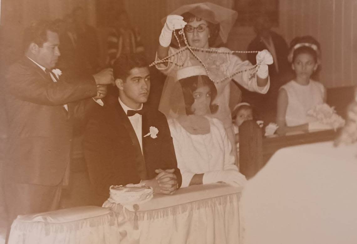 Rita and Mike Utt receiving the traditional Mexican lasso at their wedding in 1965.