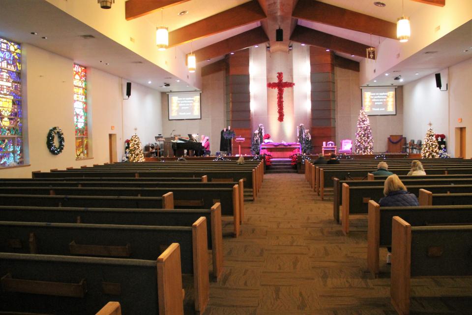 The sanctuary at Grace United Methodist Church with candles lit, live music and socially distanced pews during the COVID-19 safe Christmas Moments.

Grace United Methodist Church held its first Christmas Moments: A Come and Go Holiday Experience December 2, 2020