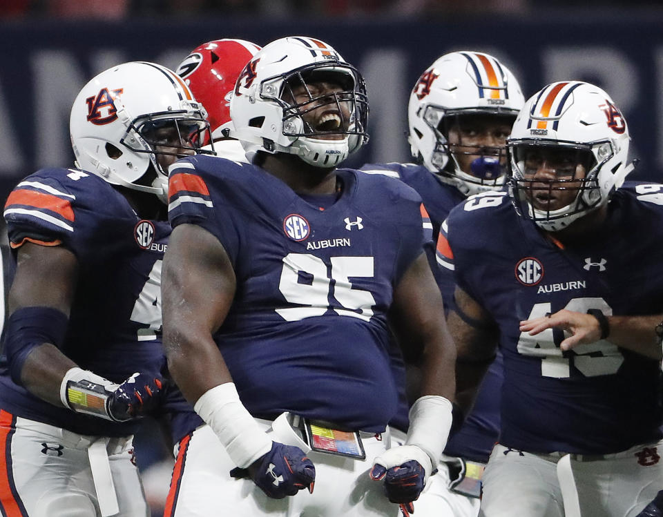 Four-year starter Dontavius Russell (95) is the anchor of Auburn’s ferocious front seven. (AP Photo)