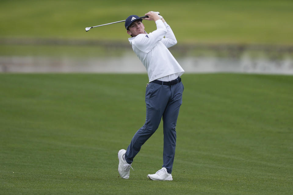 Nick Dunlap hits from the fairway on the eighth hole at the La Quinta Country Club course during the third round of The American Express golf tournament Saturday, Jan. 20, 2024, in La Quinta, Calif. (AP Photo/Ryan Sun)