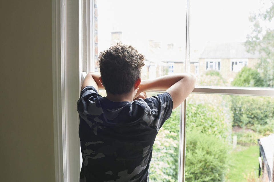 A kid looking out the window