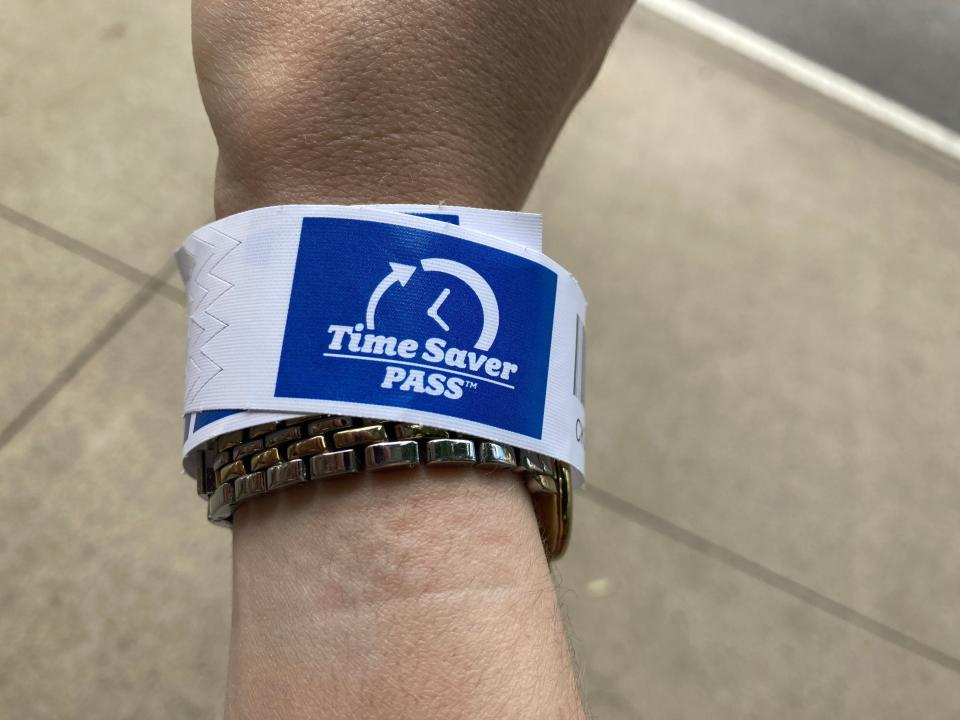 A TimeSaver Pass on a wrist at Dollywood.