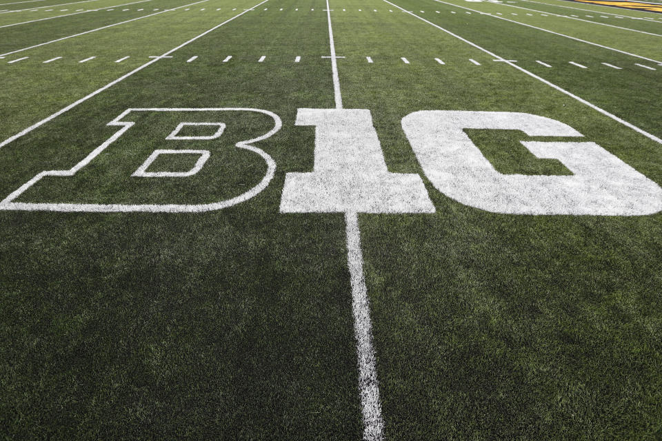 FILE - In this Aug. 31, 2019, file photo, the Big Ten logo is displayed on the field before an NCAA college football game between Iowa and Miami of Ohio in Iowa City, Iowa. Six Big Ten football games will be played at different sites than originally planned and dates for many matchups have been changed on the revised 2021 conference schedule released Friday, Feb. 5, 2021. (AP Photo/Charlie Neibergall, File)