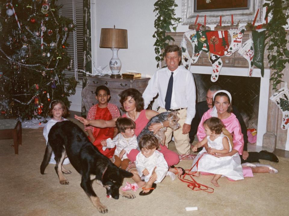 John F. Kennedy and Jackie Kennedy pose with their family on Christmas Day at the White House in 1962.