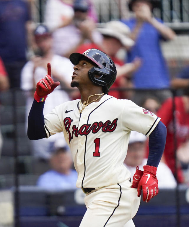 Ozzie Albies of the Atlanta Braves celebrates after hitting a two