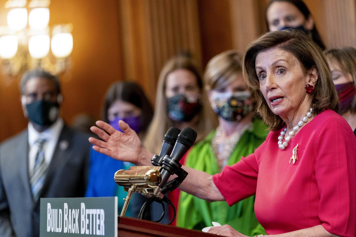 House Speaker Nancy Pelosi of Calif., accompanied by other House democrats and climate activists, pauses while speaking about their Build Back Better on Climate plan on Capitol Hill in Washington on Sept. 28, 2021. (Andrew Harnik/AP)