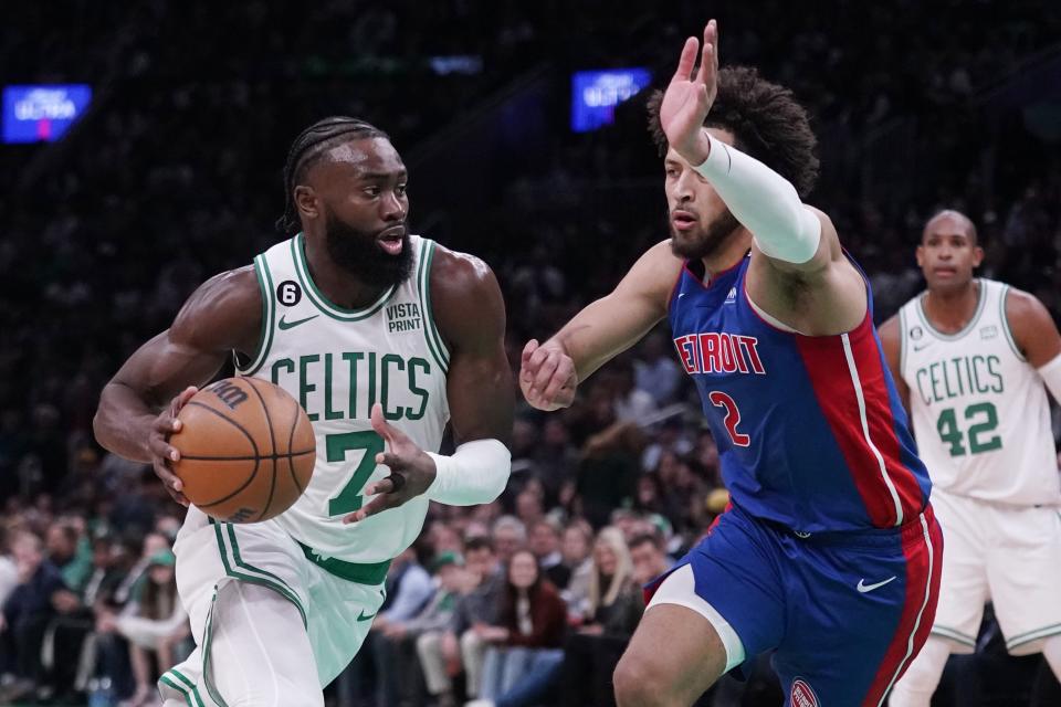 Celtics guard Jaylen Brown drives to the basket against Pistons guard Cade Cunningham during the first half Wednesday, Nov. 9, 2022, in Boston.