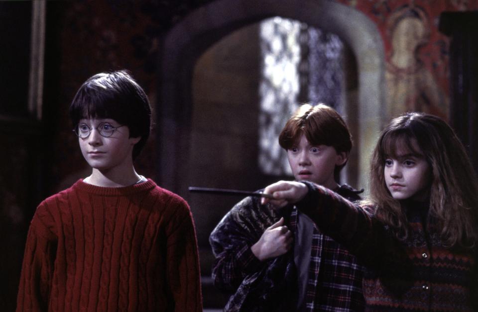 New Hogwarts students Harry Potter (Daniel Radcliffe, left), Ron Weasley (Rupert Grint) and Hermione Grainger (Emma Watson) in a scene from "Harry Potter and the Sorcerer’s Stone."